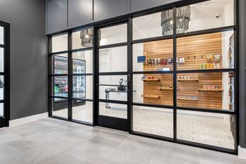 the lobby of a store with glass doors