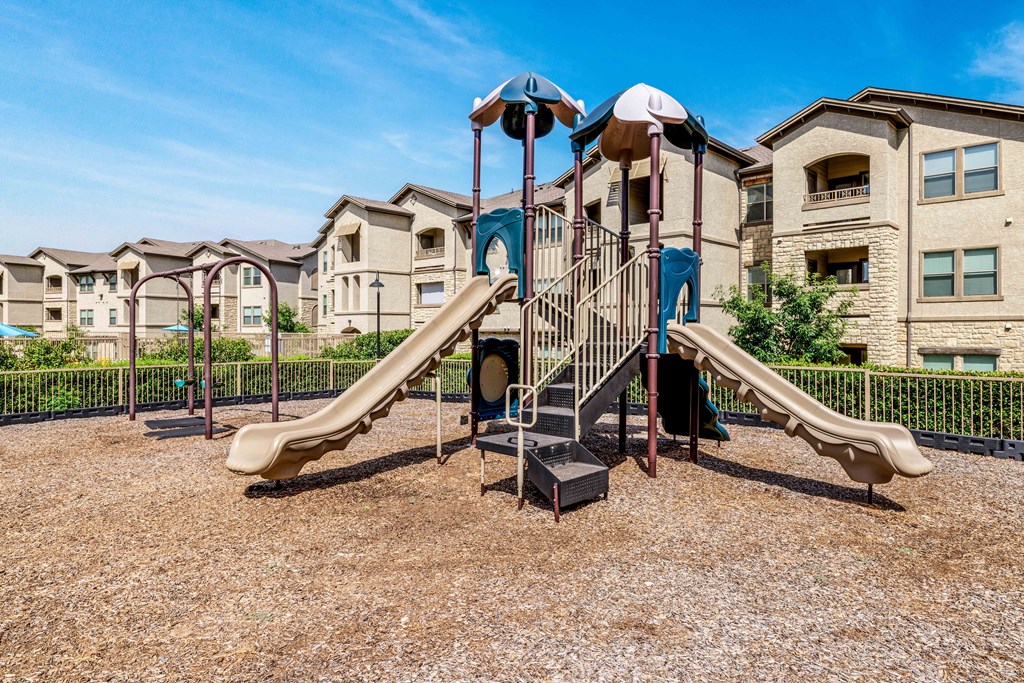 Playground with slides and two swings