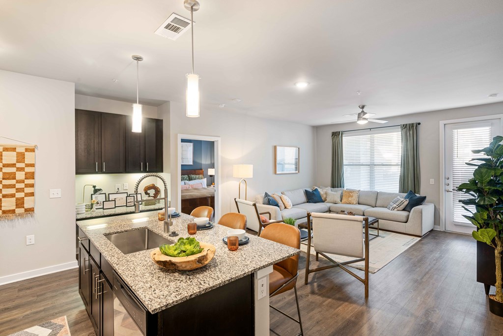 a living room with a kitchen and a dining room