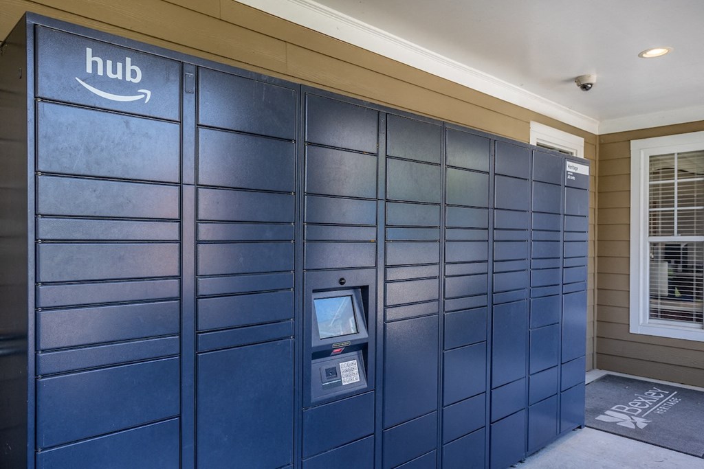 a row of package lockers in a shaded area