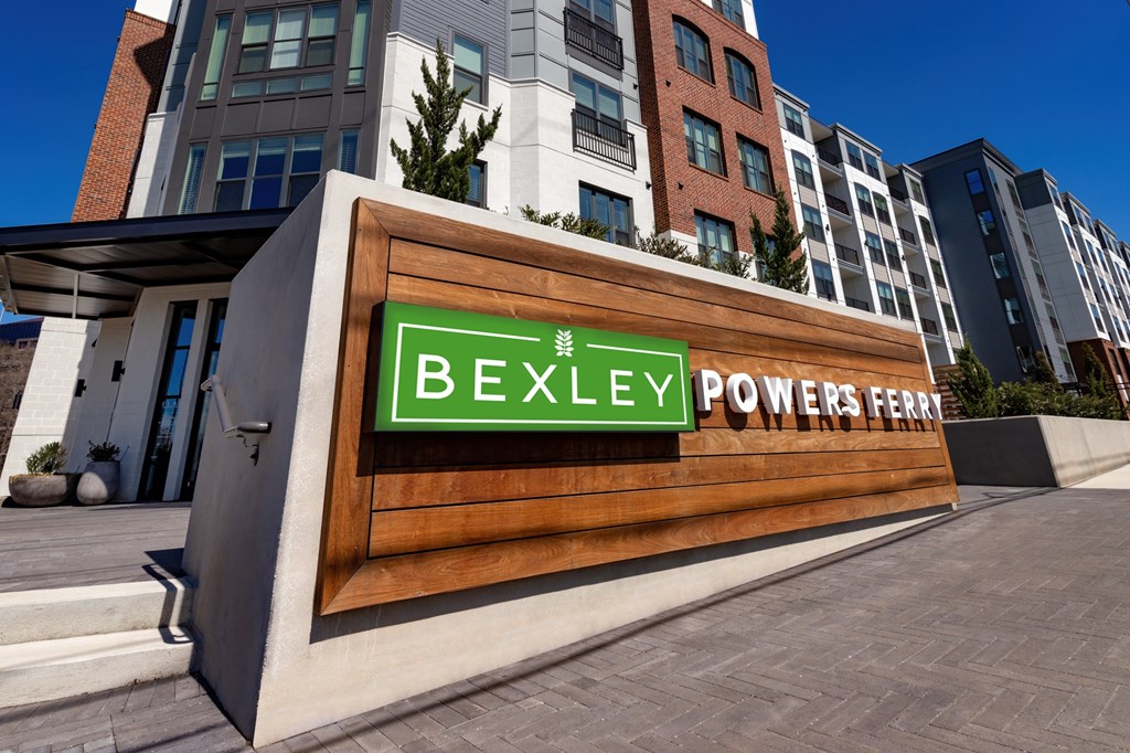 a sign for the power plant in front of a building