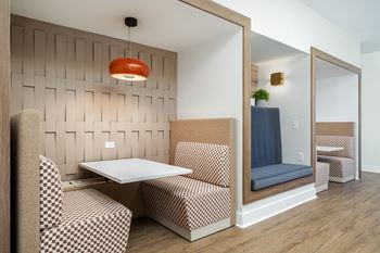 A room with a table and chairs in it.