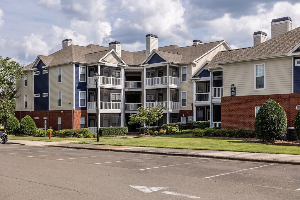 an apartment building on the corner of a street