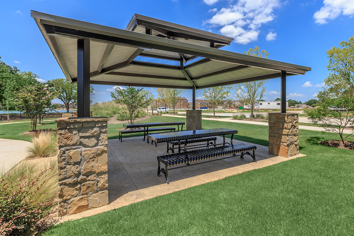 a picnic area at a park with benches