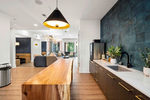 a kitchen with a wooden counter top and a sink