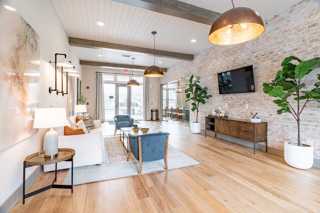 a living room filled with furniture and a flat screen tv