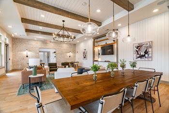 Clubhouse with tables and chandelier