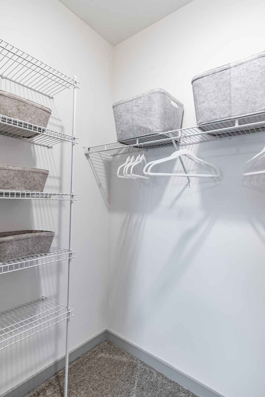 a walk in closet in a 555 waverly unit