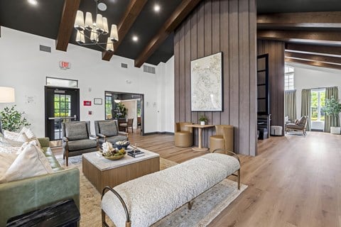 A living room with a large couch and a coffee table.