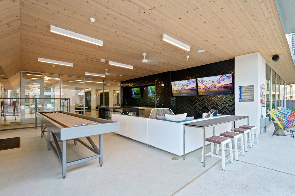 Covered Poolside Sports Lounge with TVs and Shuffleboard