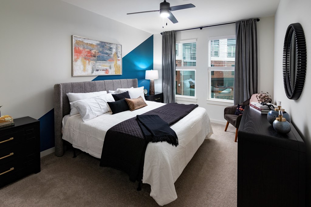 a bedroom with a large bed and a window