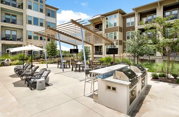 the preserve at ballantyne commons outdoor patio with barbecue grill and tables and chairs