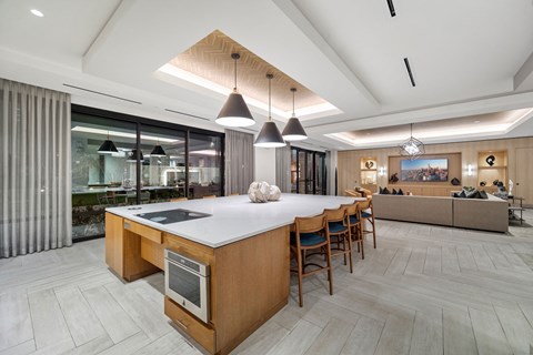 a large kitchen with a large island and chairs
