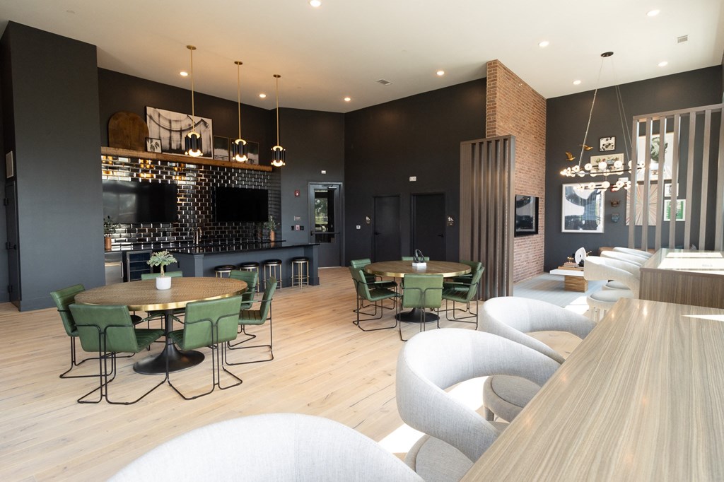 a dining room with tables and chairs and a bar