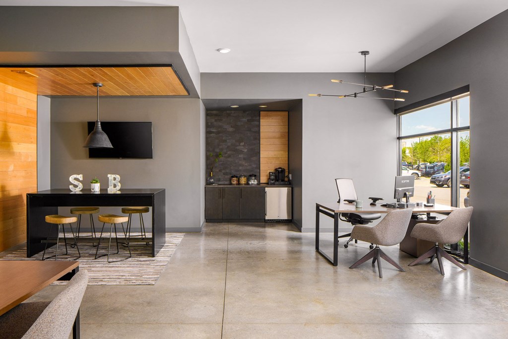 a living room and dining room with a table and chairs