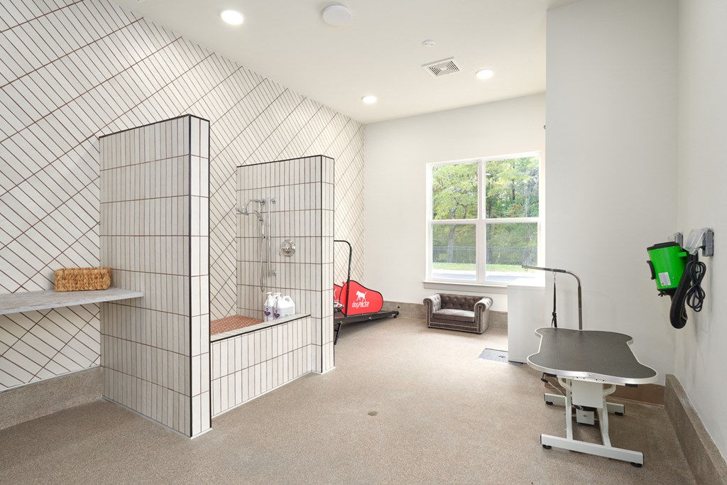 A room with a tiled wall and a table.