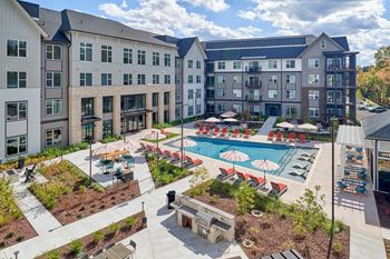 A large building with a pool in front.