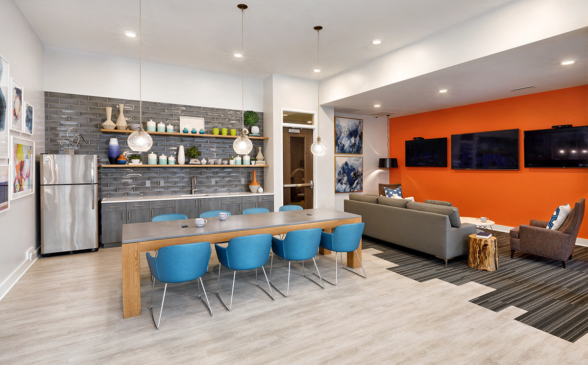 a dining room and living room with a table and chairs