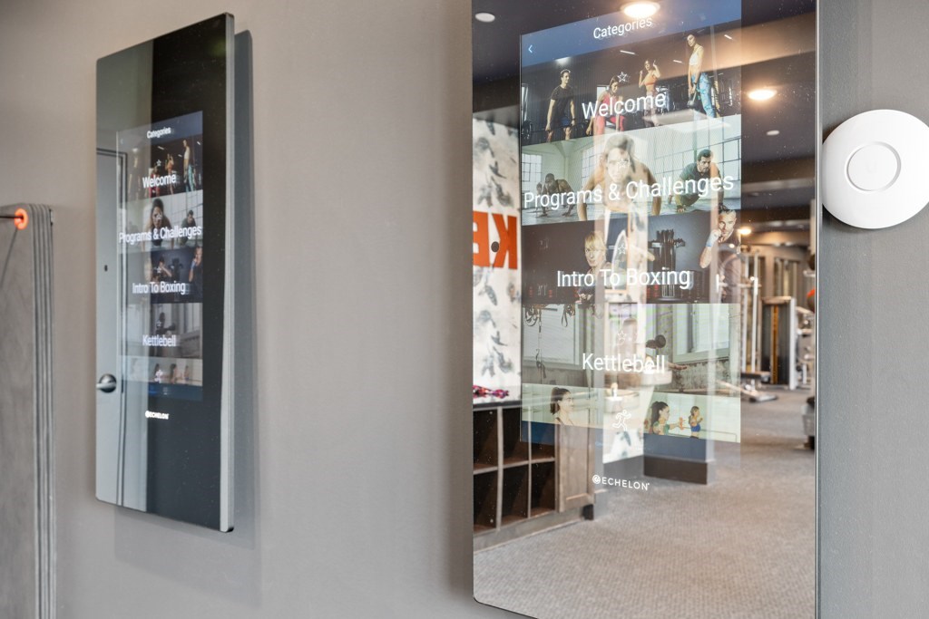 A modern room with a glass wall and a white door.