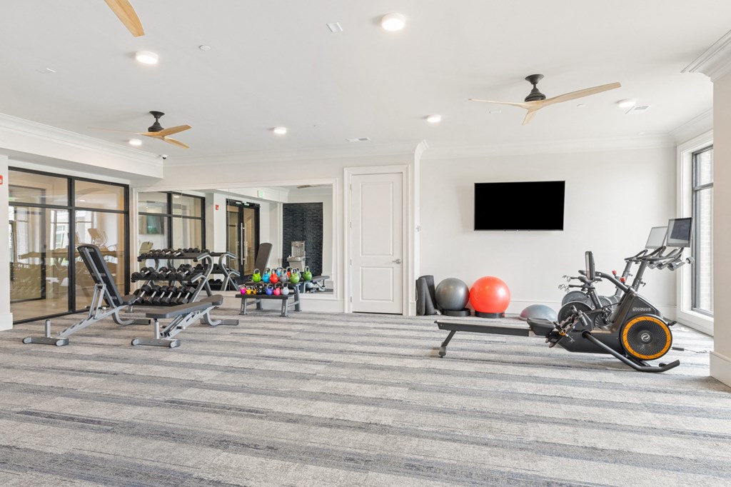 the gym at the enclave at woodbridge apartments in sugar land, tx