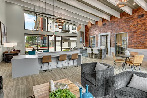 a living room with a kitchen and a dining room