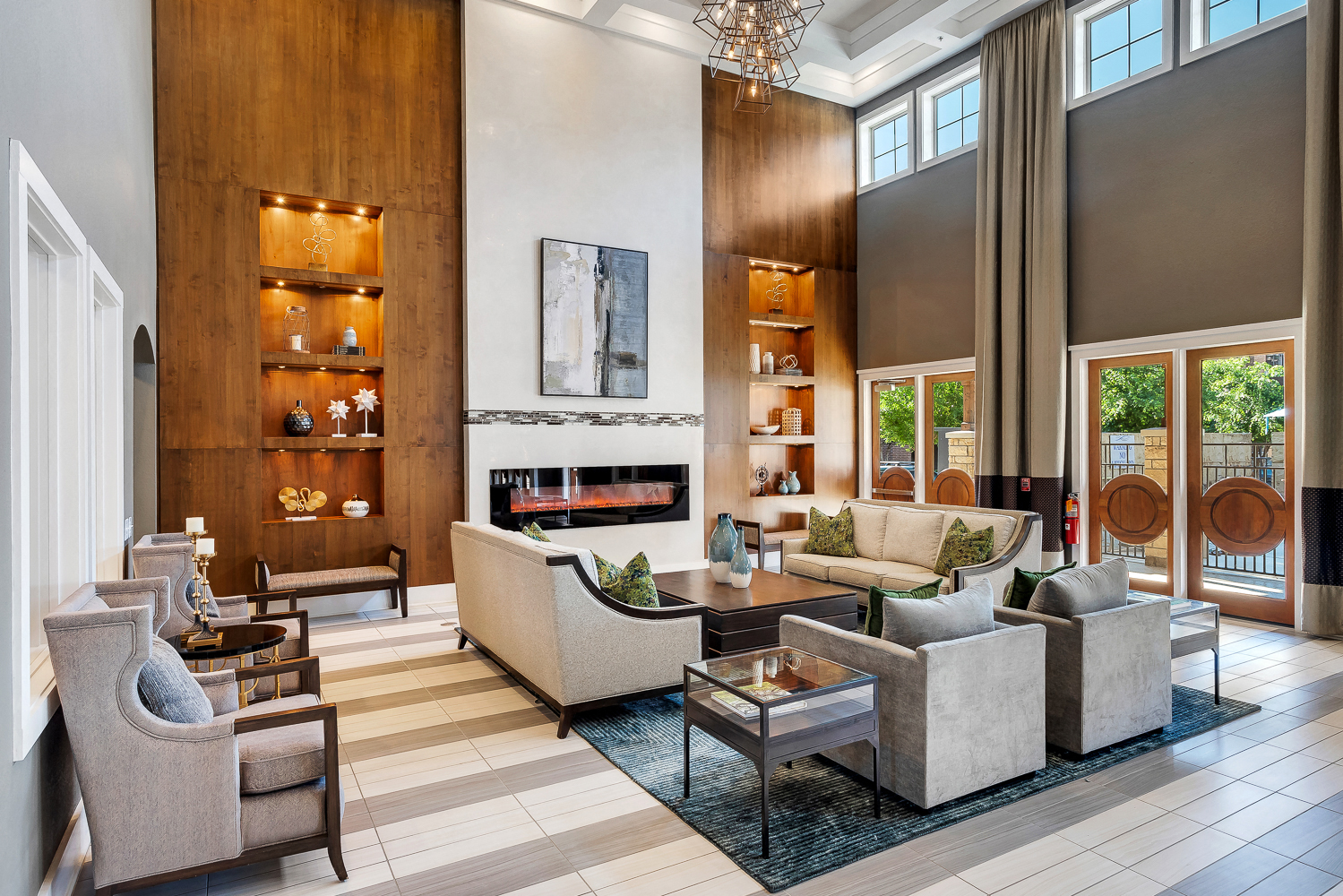 a living room with couches and chairs and a fireplace