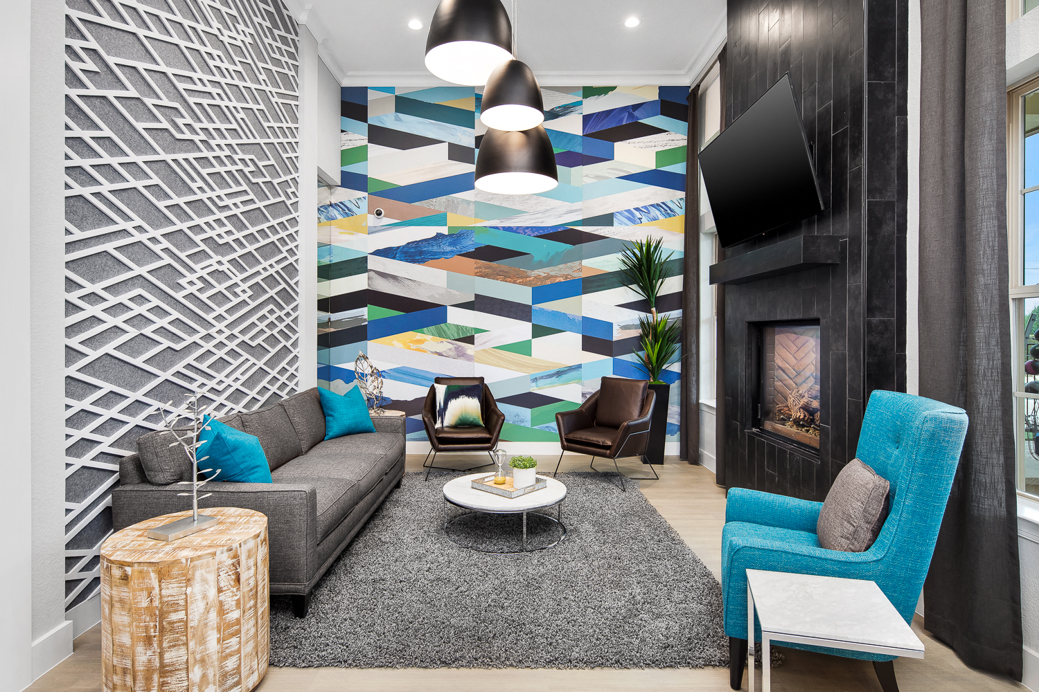 a living room with a couch and chairs and a fireplace