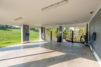 A garage with a concrete floor and a white ceiling.