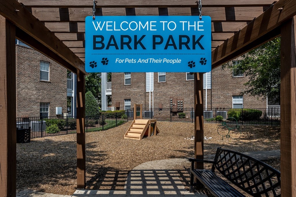 a sign that reads welcome to the bark park for kids and their people