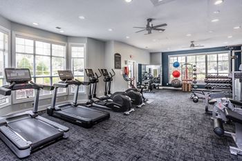 the gym at the district flats apartments in lenexa
