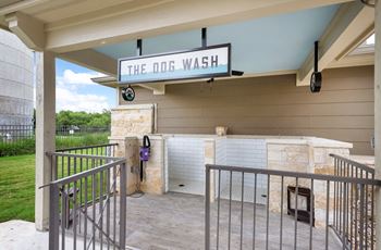 a covered porch with a bar and a sign that says theo wash on it