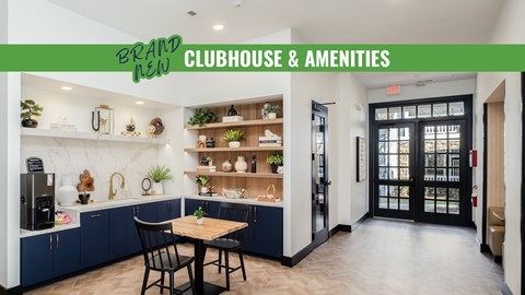 A modern kitchen with a dining table and chairs is shown.