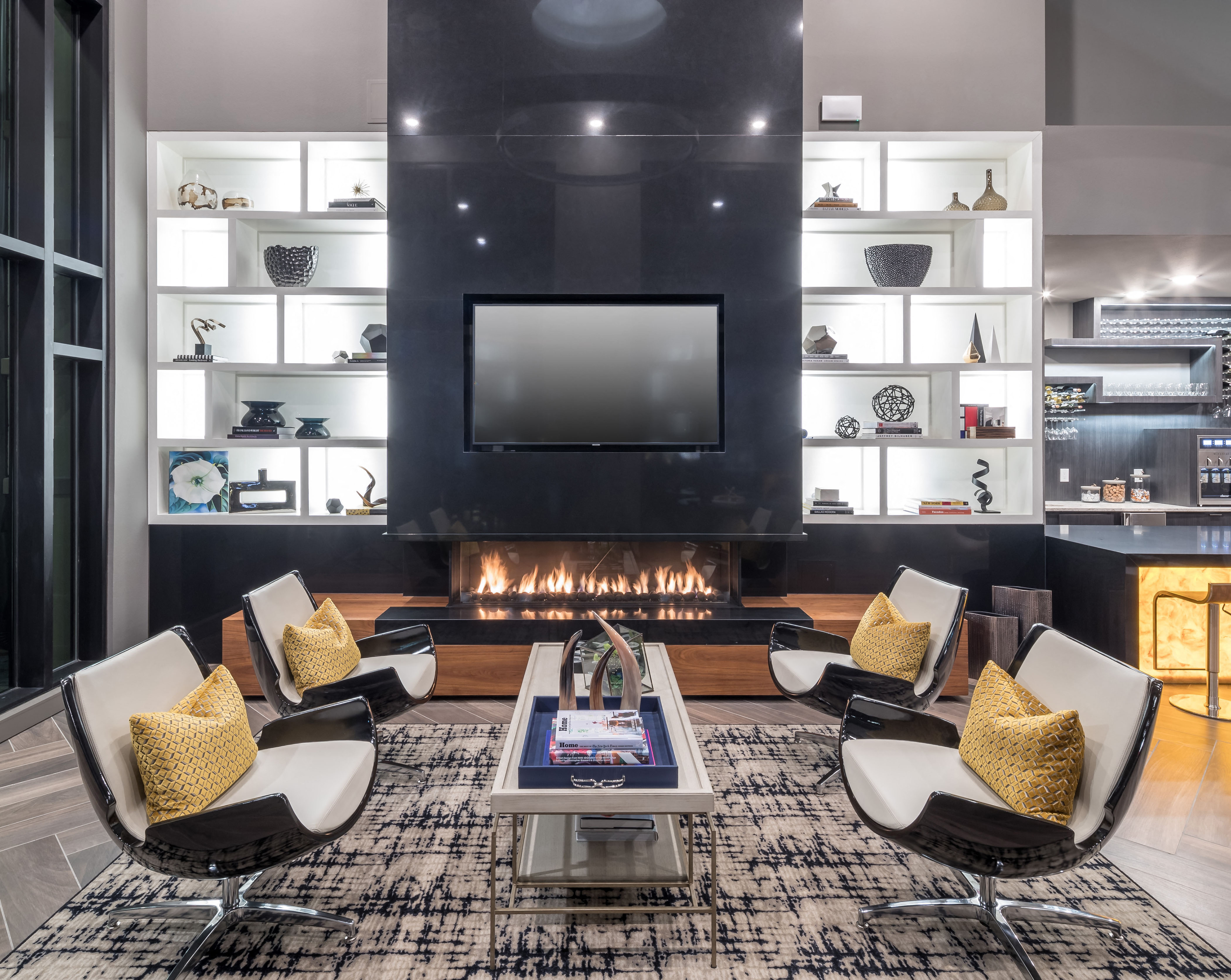 a living room with a fireplace and a television