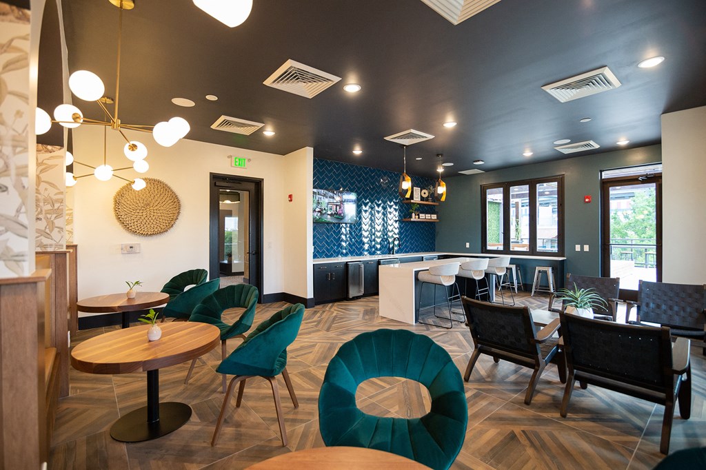 a dining room with tables and chairs and a bar