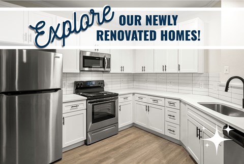 A kitchen with a refrigerator, oven, microwave, and sink is showcased.