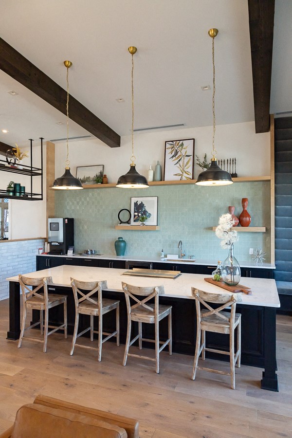 a kitchen with a table and chairs in a house