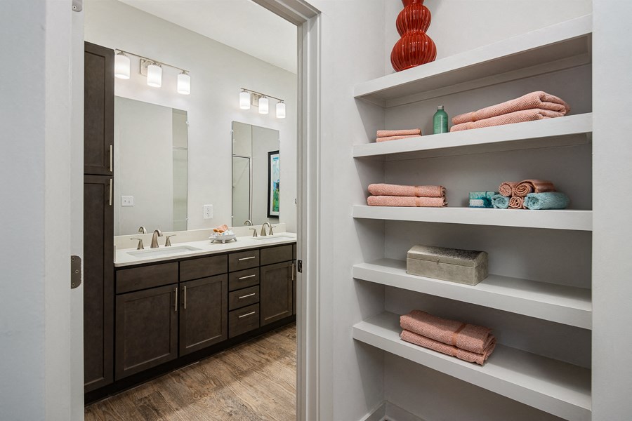 the residence on lamar apartment homes bathroom with sink and mirror