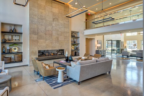 the preserve at gateway living room with couches and a fireplace