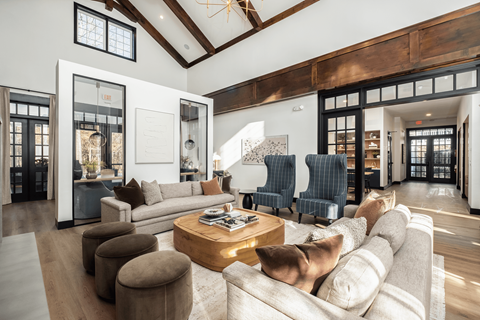 A modern living room with a large couch and a coffee table.