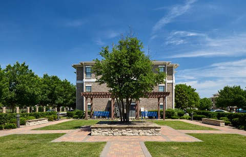 A large building with a tree in front of it.