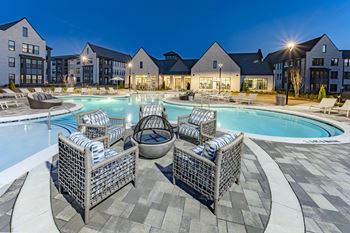 our apartments offer a swimming pool with lounge chairs and umbrellas