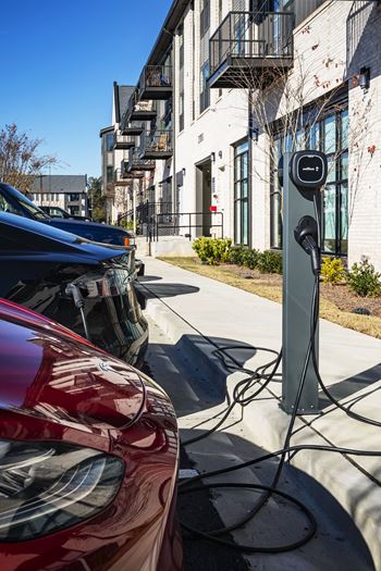 a car is plugged in to a electric charger