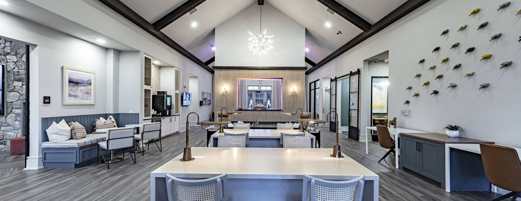 a dining room with tables and chairs and a lounge area with a fireplace