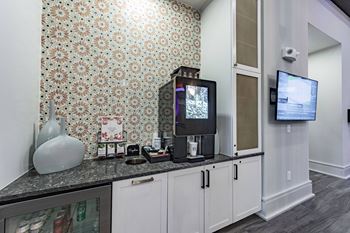 a kitchen with a counter top and a tv