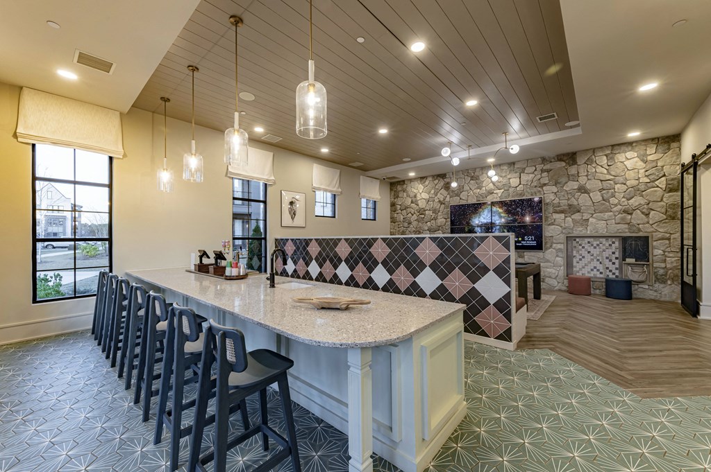 a kitchen with a marble counter top and a fireplace