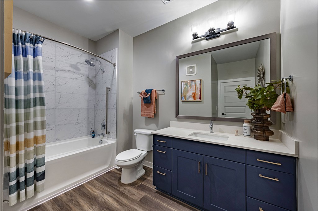 the residence on lamar apartment bathroom with shower sink and toilet