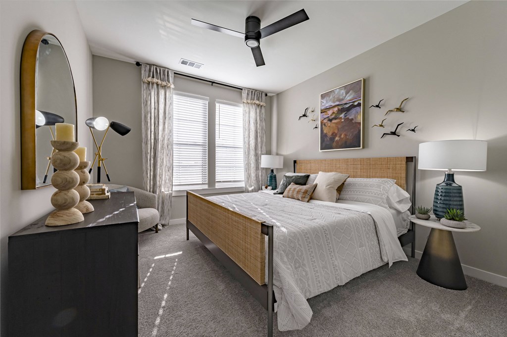 a bedroom with a bed and a dresser and a window