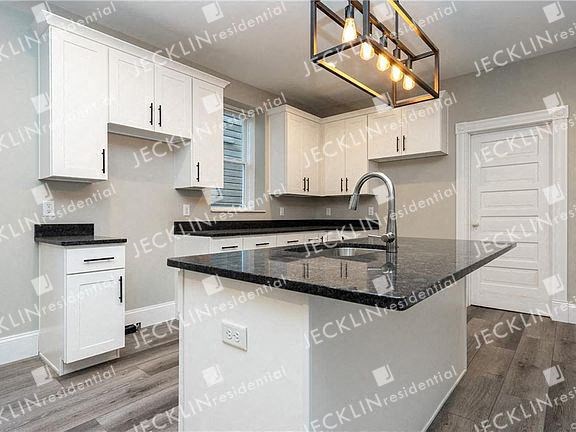 a kitchen with a counter top and a sink
