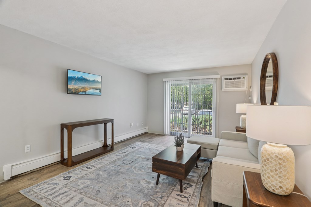 Carpeted Living Room at Heritage at the River, New Hampshire