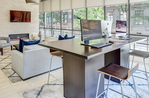 Resident lounge  with desk with a computer  at The View at Old City, Philadelphia